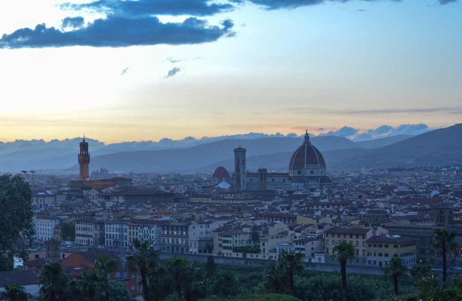 Florence skyline at dusk with the cathedral dome visible.
