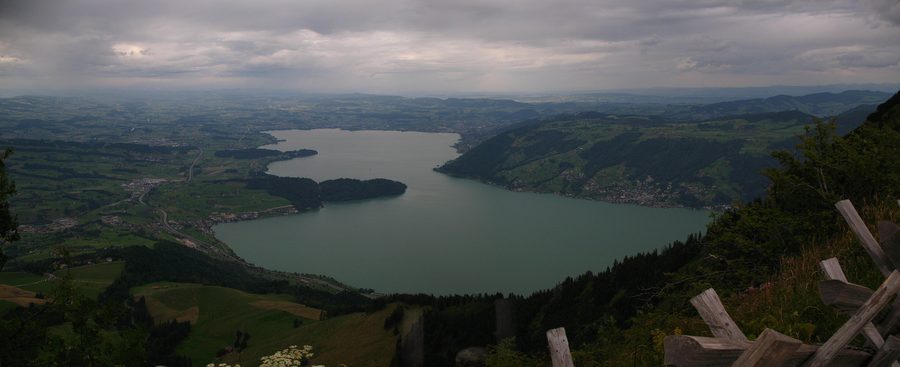 Lake Zug seen from Rigi, with the shoreline and mountains in the distance.