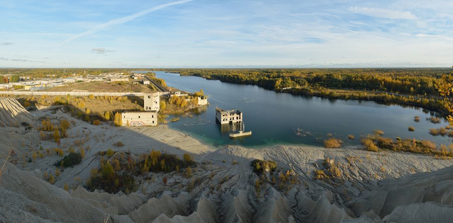 Rummu quarry in Estonia with the flooded former limestone mine and submerged building complex.