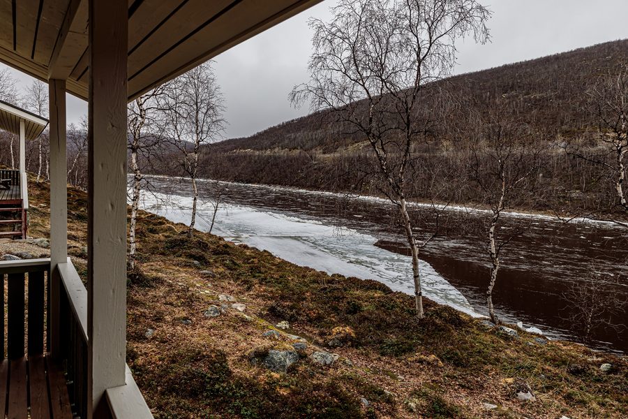 The Teno River along the Finland-Norway border near Utsjoki, with northern Lapland landscape.