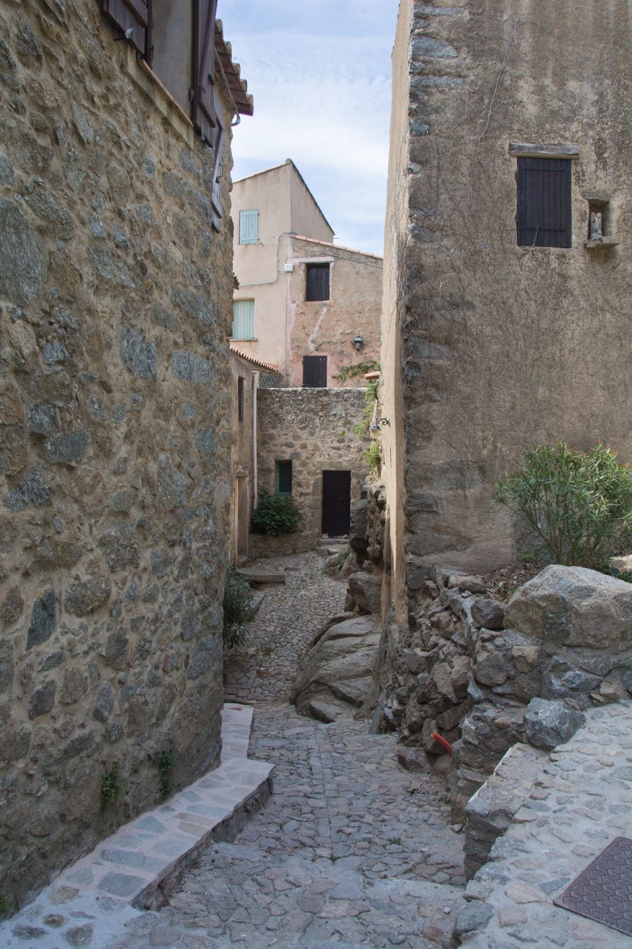 Descending narrow street in the medieval village of Sant'Antonino