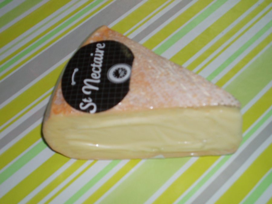 A wheel of Saint-Nectaire cheese.