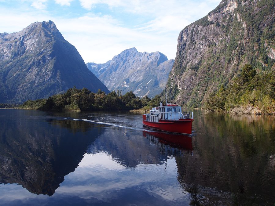Boat travelling toward Milford Sound in Fiordland National Park