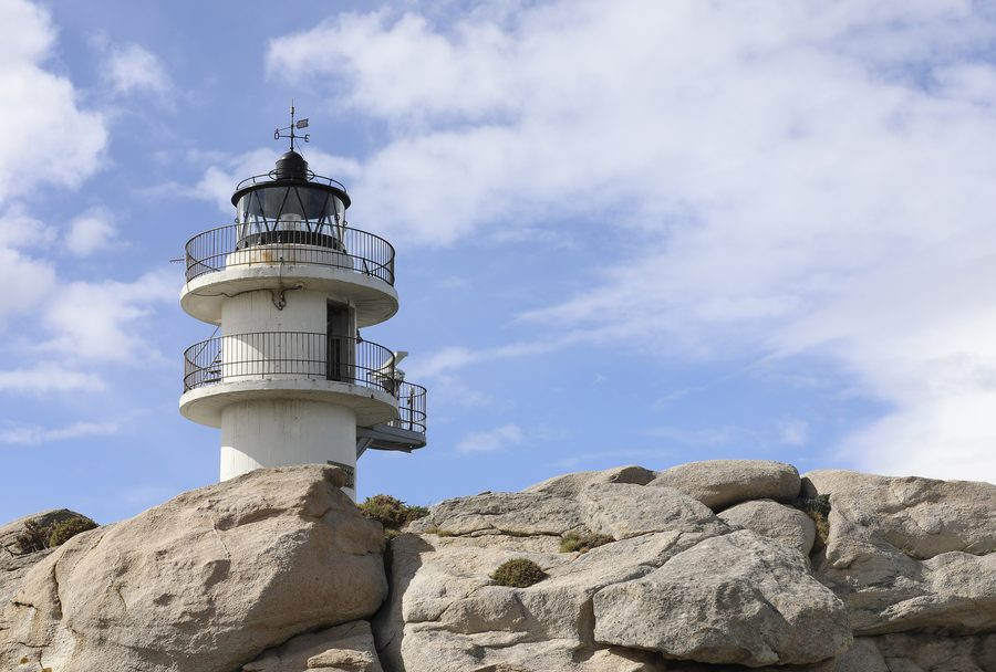 Lighthouse of Punta Roncadoira on the coast of Portocelo, Xove, Galicia, Spain.
