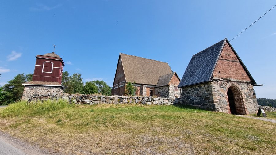 Exterior of Hattula's medieval Holy Cross Church in Finland