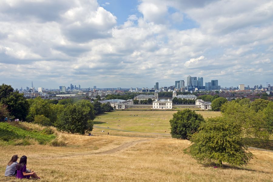 View of Maritime Greenwich World Heritage Site from near the Royal Observatory, with the Thames and London skyline