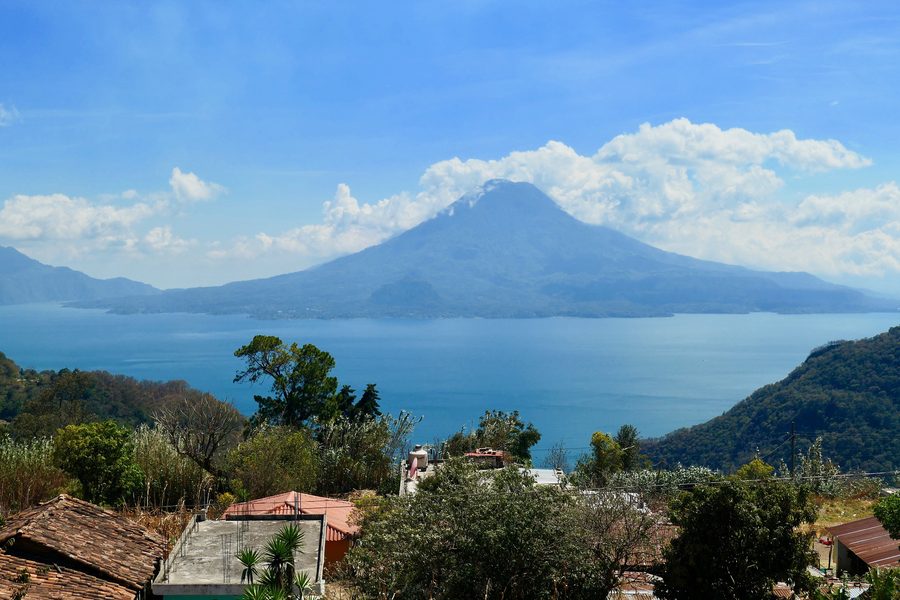 Lake Atitlán seen from a hillside viewpoint with the lake stretching across the valley.