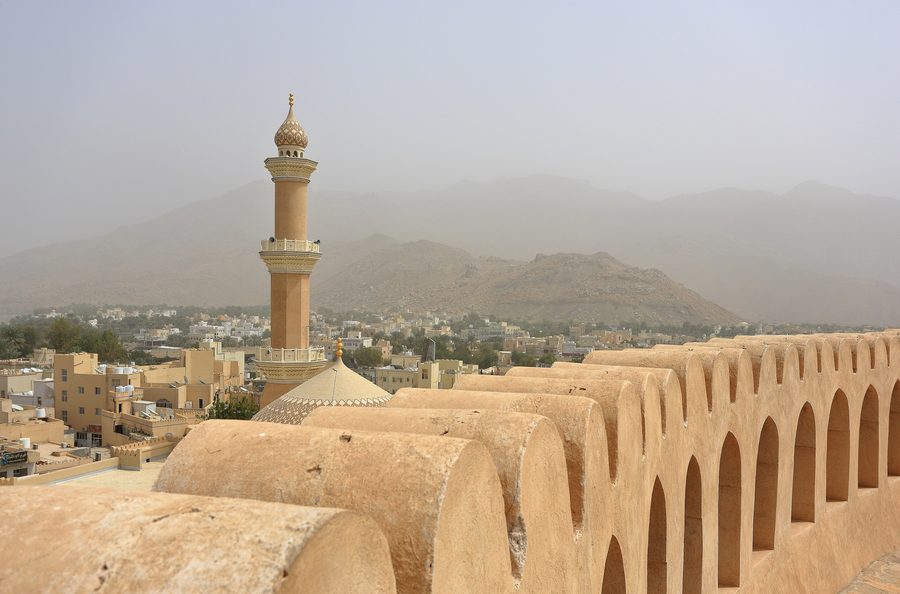 The minaret of Friday Mosque seen from Nizwa Fort in Nizwa, Oman