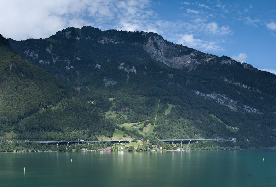 Urnersee with steep alpine slopes rising behind the lake near Flüelen.