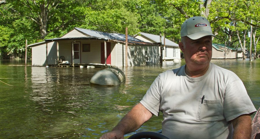 Motorboat surveying Mississippi River flooding in Lauderdale County, Tennessee